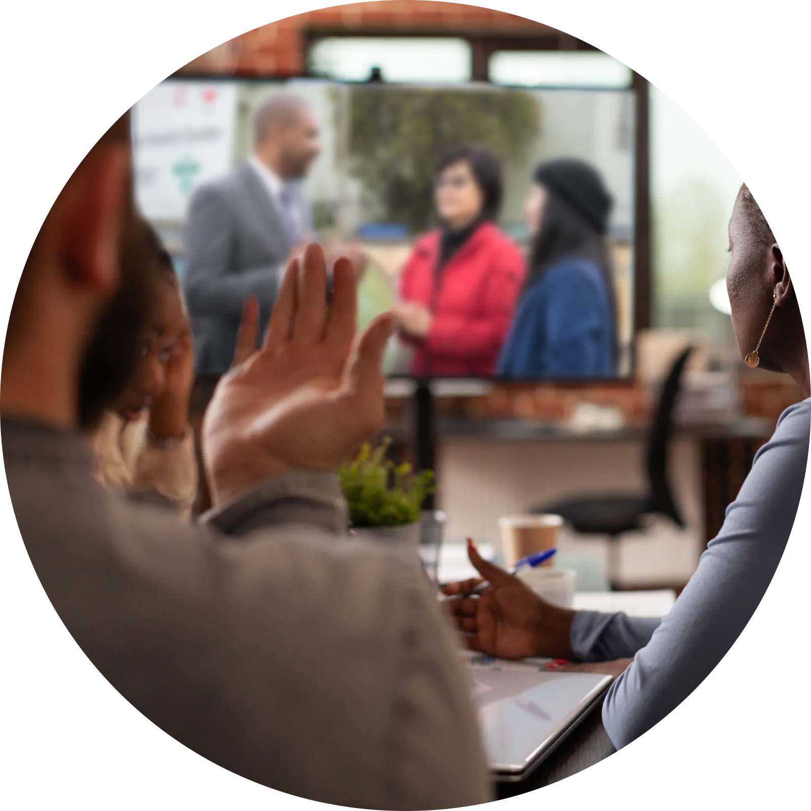 Candidate Shamann Walton speaking with multi-racial supporters at indoor community gathering.