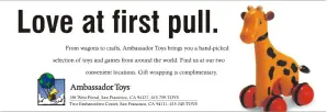 Horizontal newspaper advertisement featuring toy giraffe on red wheels, with headline "Love at first pull."